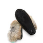 Alberta suede moccasins in coffee and black with a plush rabbit fur ankle collar and side stitching. Photo of bottom view.