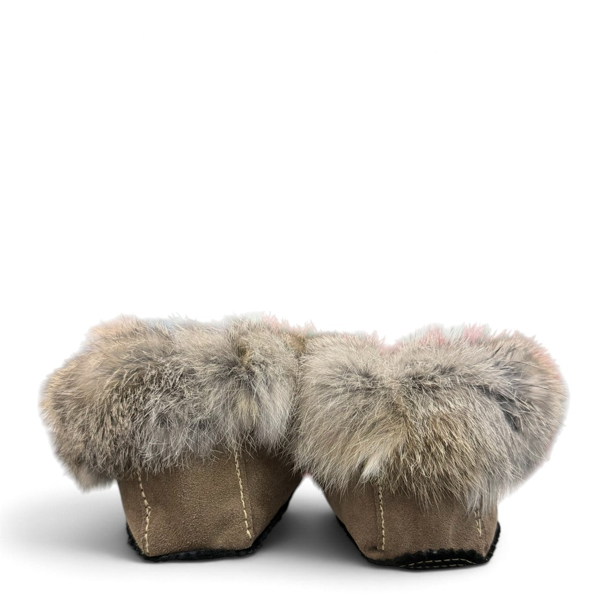 Alberta suede moccasins in coffee and black with a plush rabbit fur ankle collar and side stitching. Photo of back view.