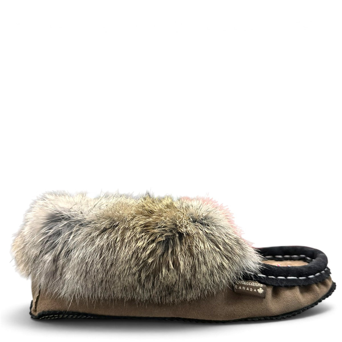Alberta suede moccasins in coffee and black with a plush rabbit fur ankle collar and side stitching. Photo of right side view.