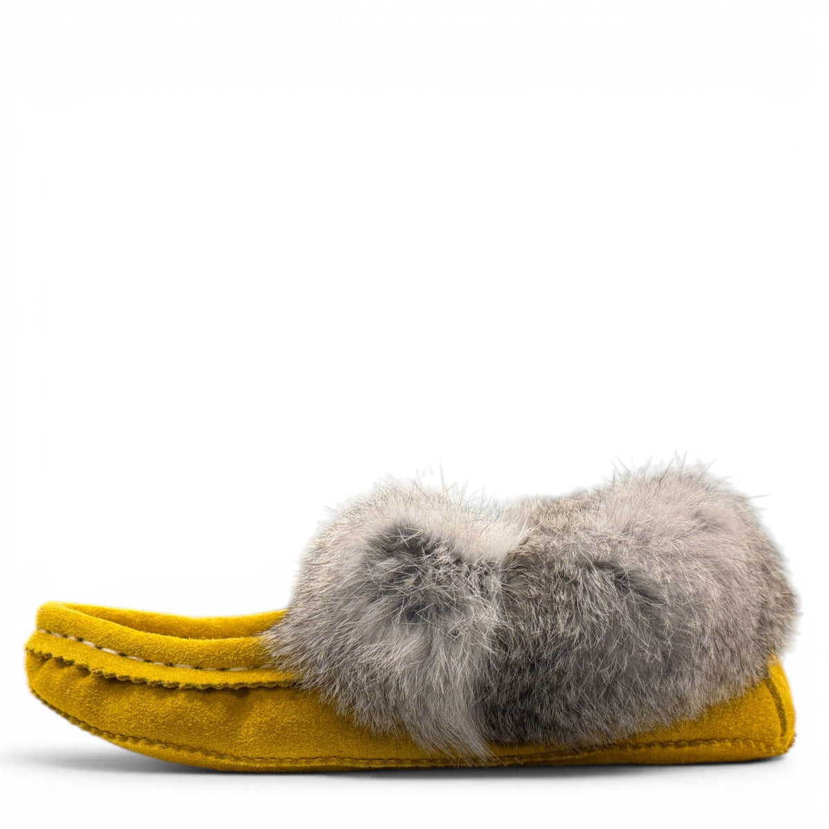 alberta-suede-moccasins yellow cowhide suede moccasins with a soft rabbit fur ankle collar, handcrafted for cozy comfort.
photo of the left side