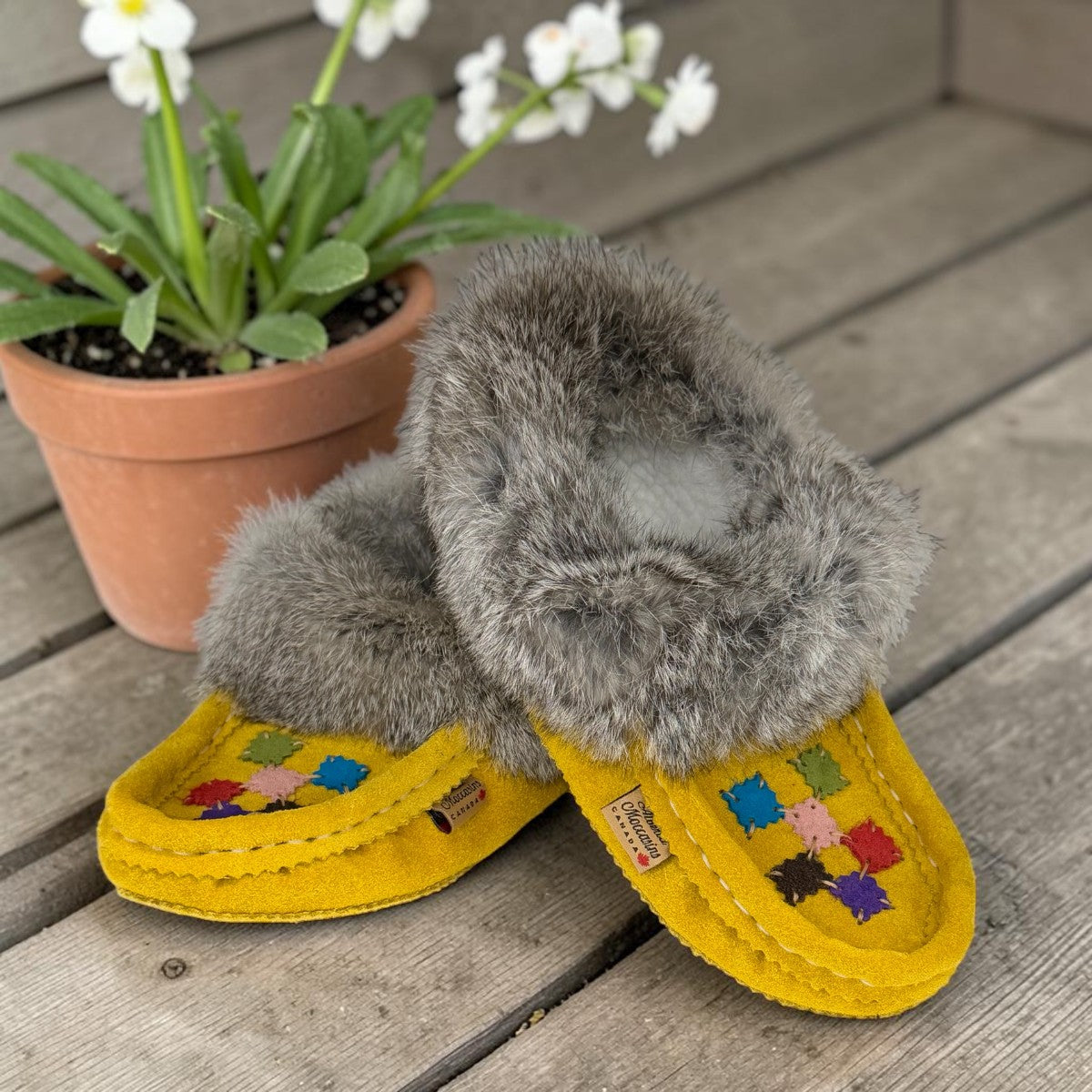 alberta-suede-moccasins yellow cowhide suede moccasins with a soft rabbit fur ankle collar, handcrafted for cozy comfort.
photo of the front side