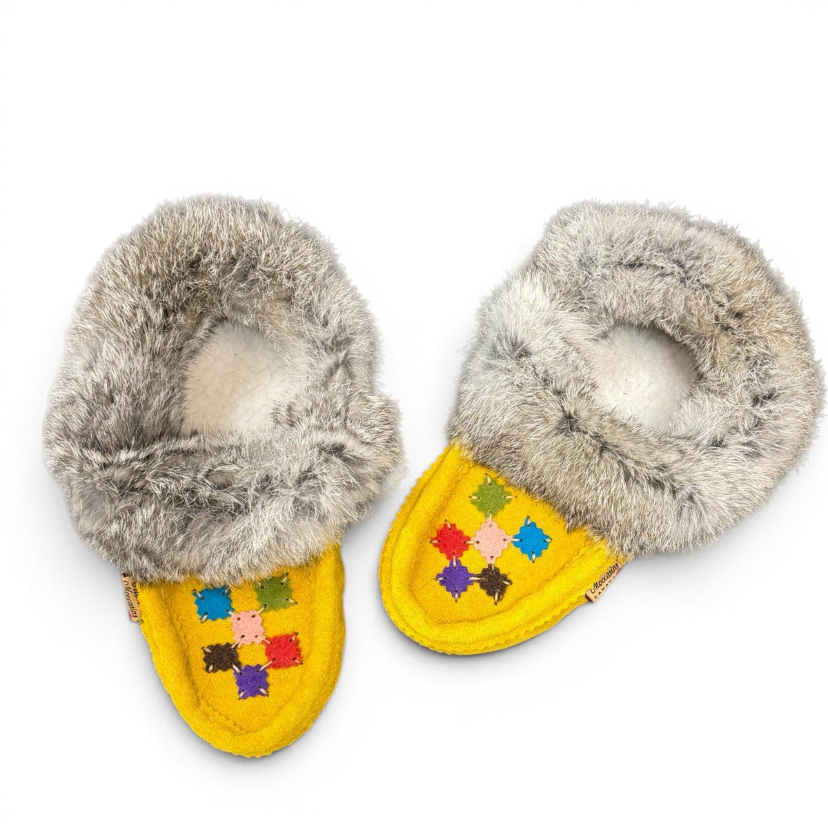 alberta-suede-moccasins yellow cowhide suede moccasins with a soft rabbit fur ankle collar, handcrafted for cozy comfort.
photo of the top side