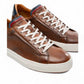 AMBITIOUS camel leather lace-up sneaker with a minimalist design and a lightweight white sole.
