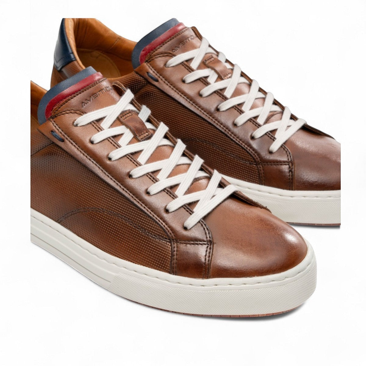 AMBITIOUS camel leather lace-up sneaker with a minimalist design and a lightweight white sole.