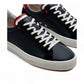 AMBITIOUS navy leather lace-up sneakers with white and red accents and a lightweight transparent sole