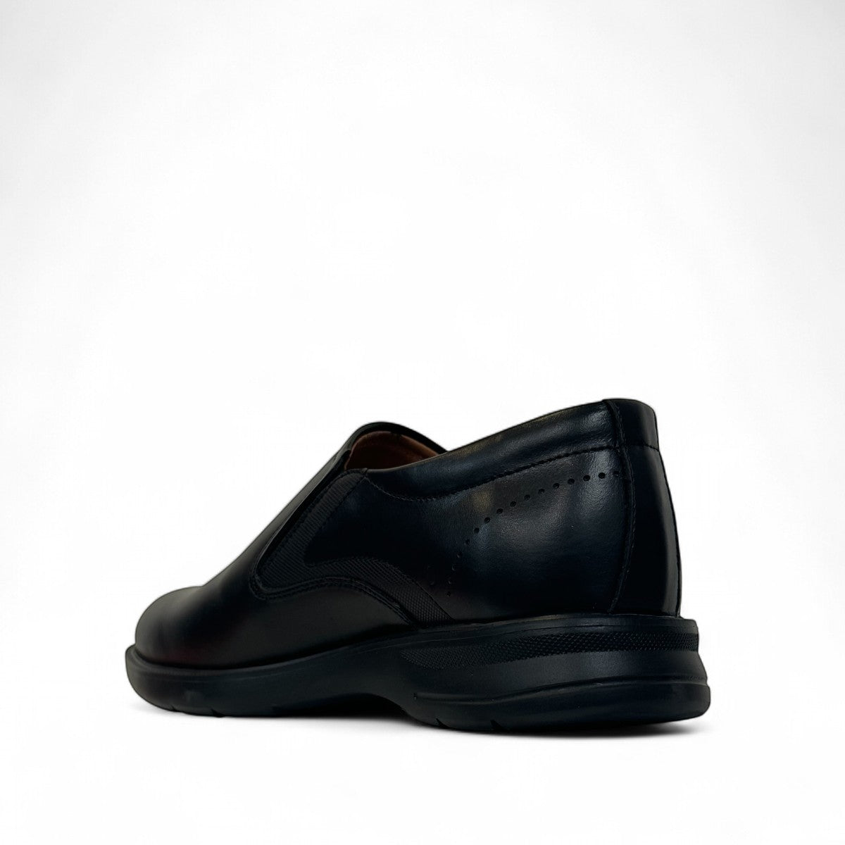 Atropat Aghdasieh black leather slip-on dress shoe with handmade stitching and rubber outsole. Photo of side view from the back.