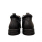 Atropat Amin black leather boots with textured upper, rubber outsole, and subtle handmade stitching. Photo of back view.