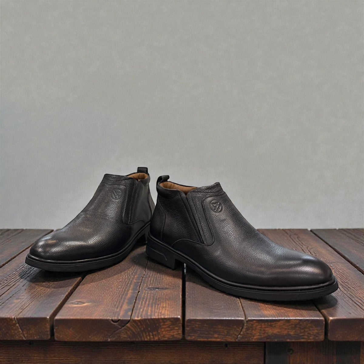 Atropat Amin black leather boots with textured upper, rubber outsole, and subtle handmade stitching. Photo of front view 2.