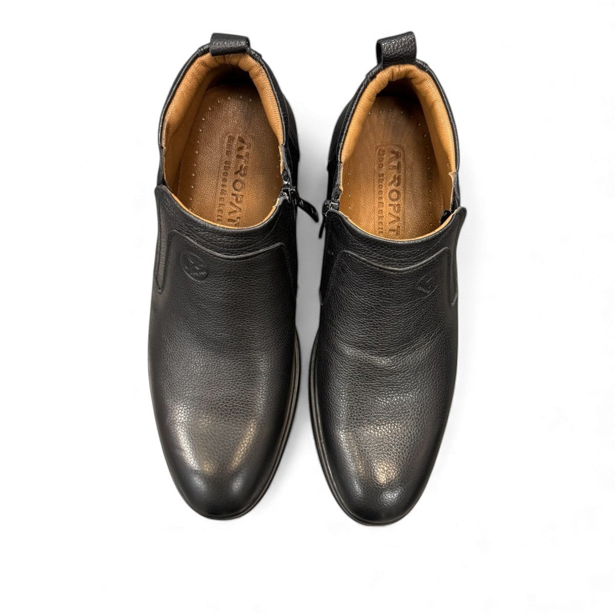 Atropat Amin black leather boots with textured upper, rubber outsole, and subtle handmade stitching. Photo of upper view.