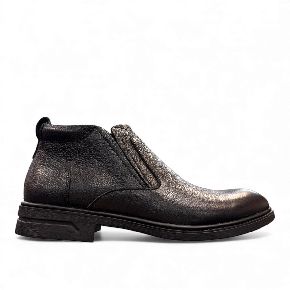 Atropat Amin black leather boots with textured upper, rubber outsole, and subtle handmade stitching. Photo of outside side view.