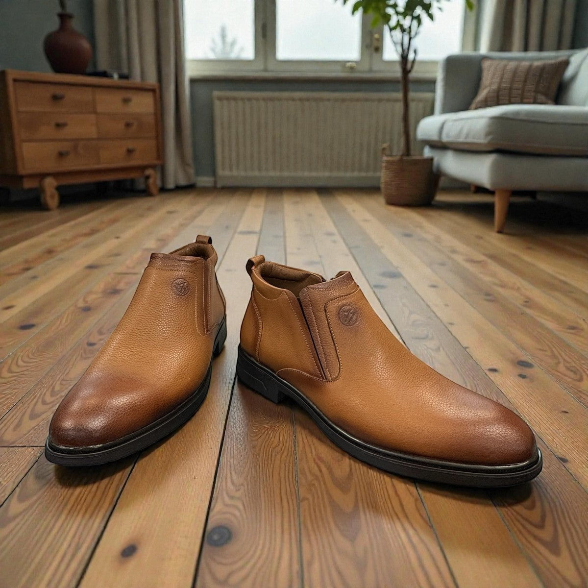 Atropat Amin brown genuine leather slip-on boots with handmade stitching and durable rubber outsole. Photo of front view at an angle 2.