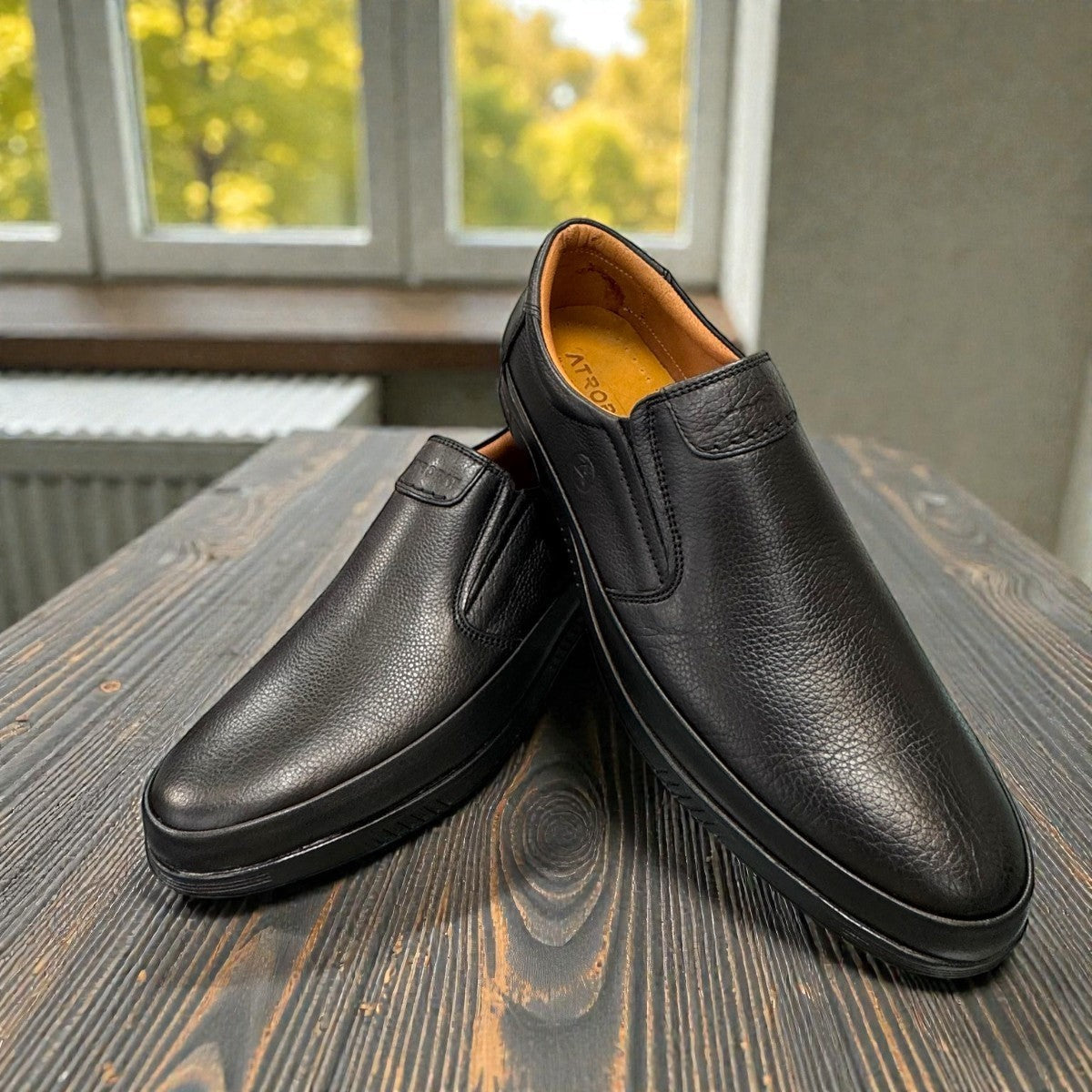 Atropat Bahar black leather slip-on shoes with handmade stitching and durable rubber outsole. Photo of front view 1.