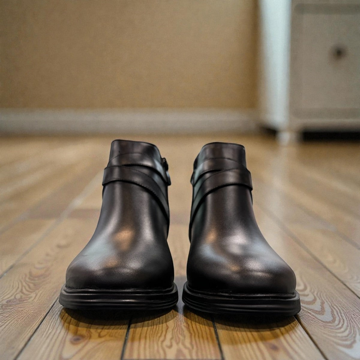 Atropat Bamdad black leather ankle boots with a side buckle strap and durable rubber outsole. Photo of front view.