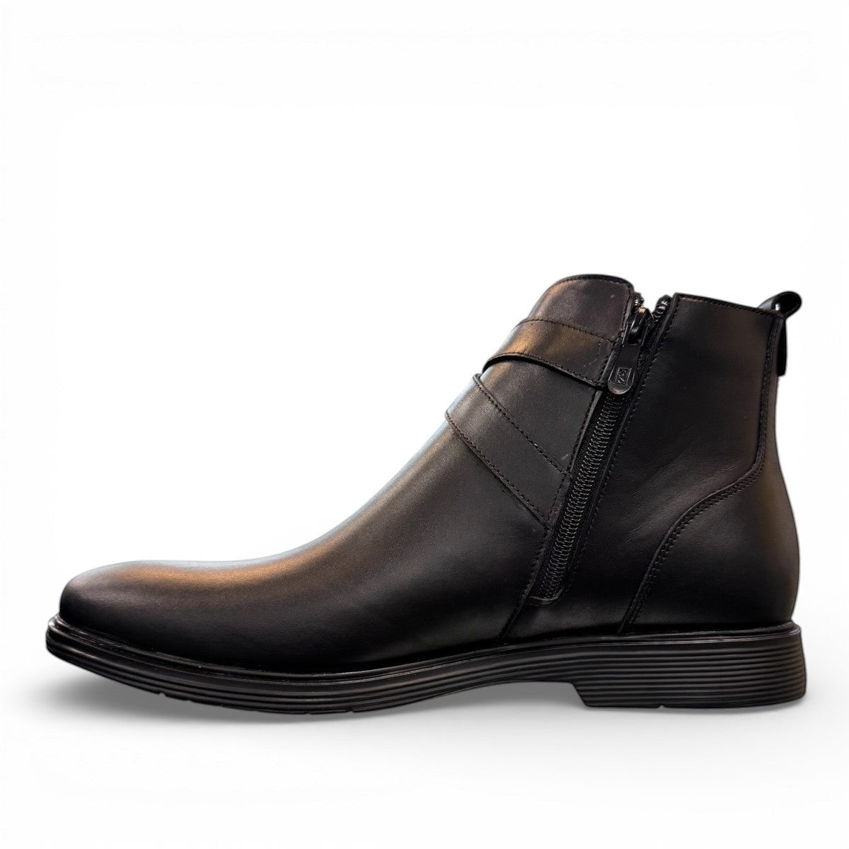 Atropat Bamdad black leather ankle boots with a side buckle strap and durable rubber outsole. Photo of inside side view.