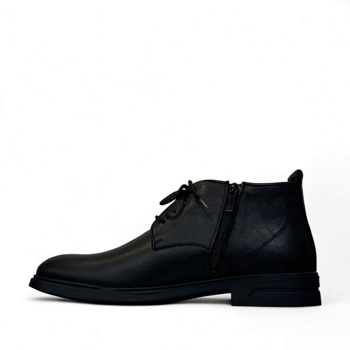 Atropat Ferdowsi black genuine leather chukka boots with handmade stitching and rubber outsole. Photo of inside side view.