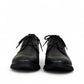 Atropat Ferdowsi black genuine leather chukka boots with handmade stitching and rubber outsole. Photo of front view.