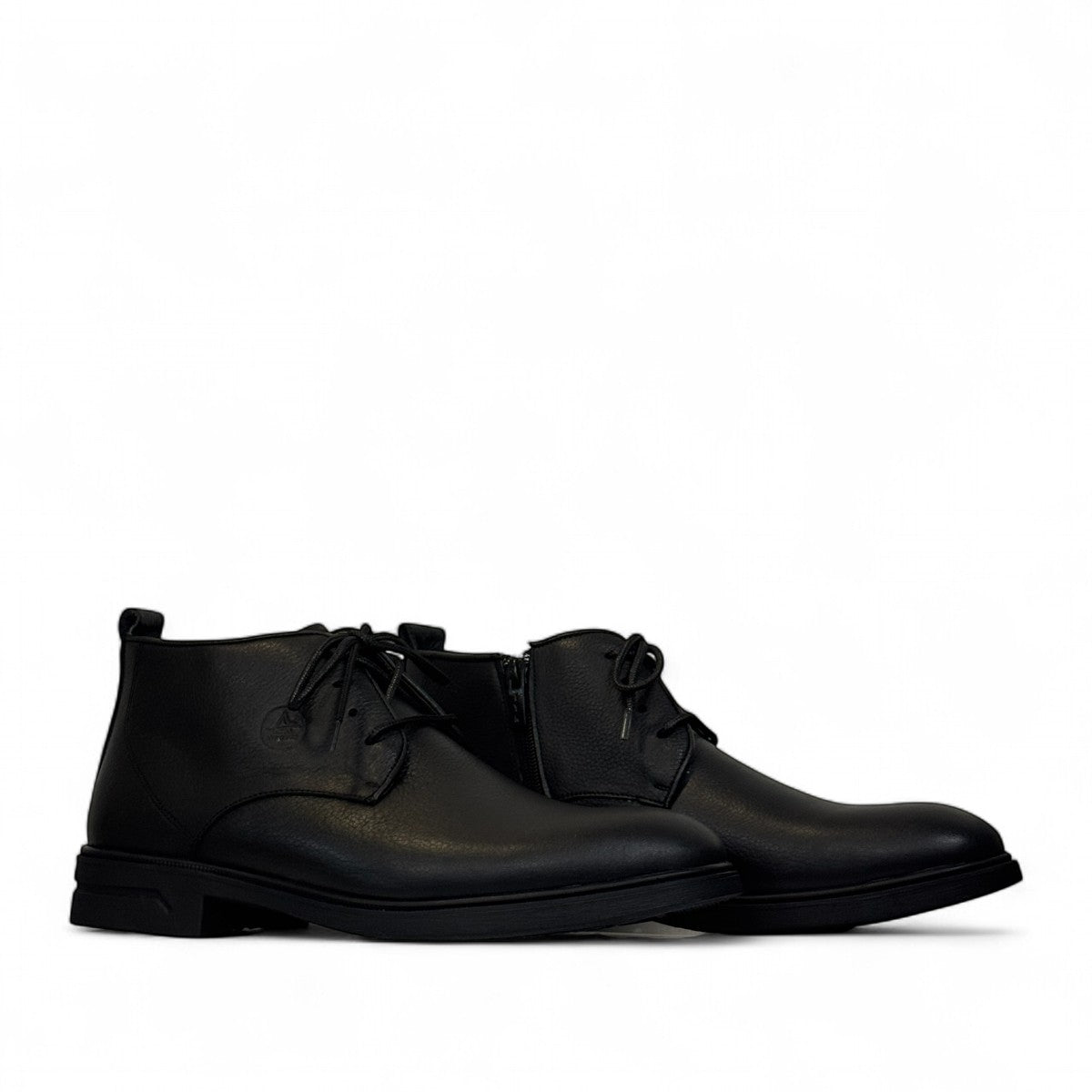 Atropat Ferdowsi black genuine leather chukka boots with handmade stitching and rubber outsole. Photo of side views.