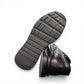 Atropat Kaya black leather slip-on shoes with textured upper and durable rubber sole. Photo of bottom view.