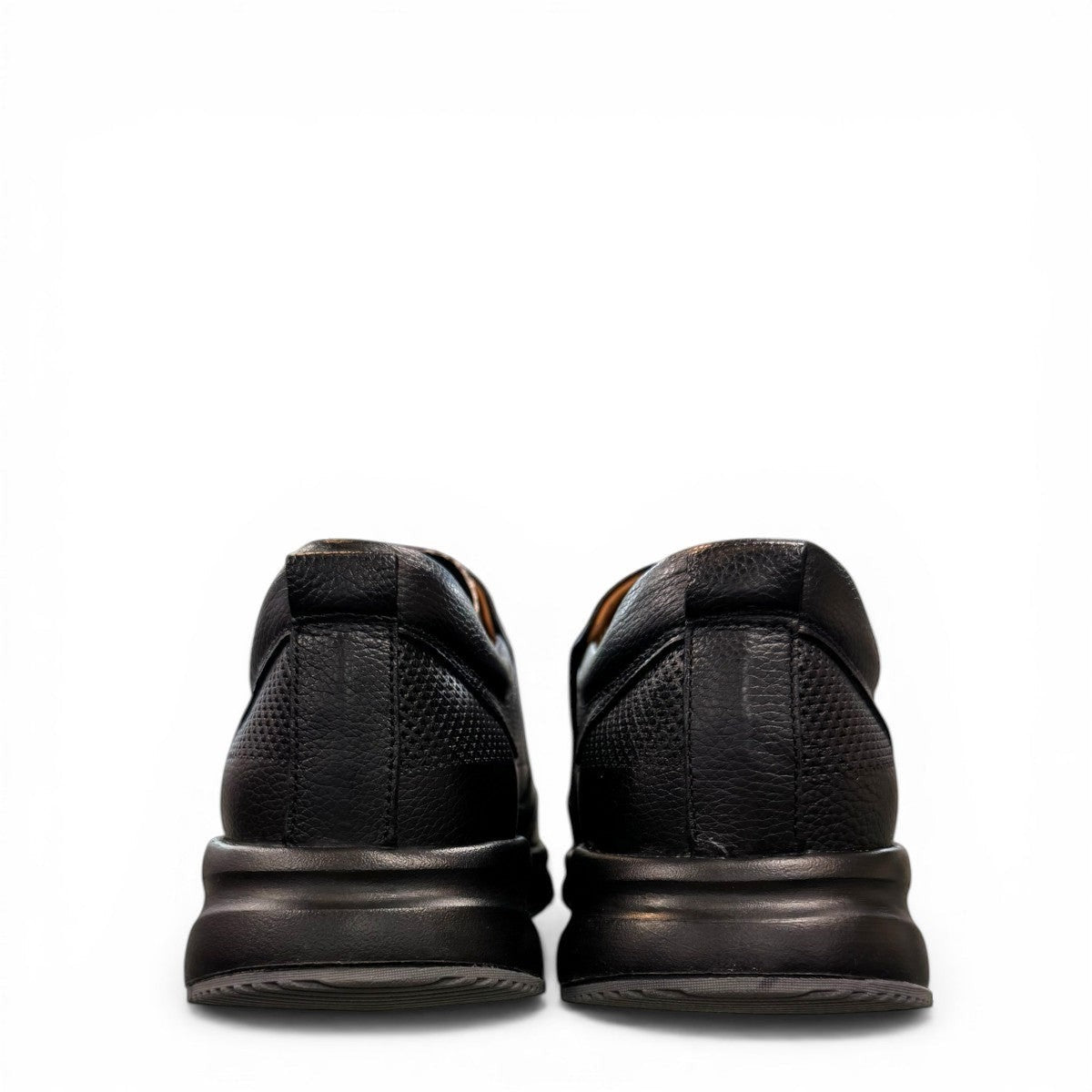 Atropat Kaya black leather slip-on shoes with textured upper and durable rubber sole. Photo of back view.