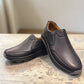 Atropat Kaya black leather slip-on shoes with textured upper and durable rubber sole. Photo of front view.