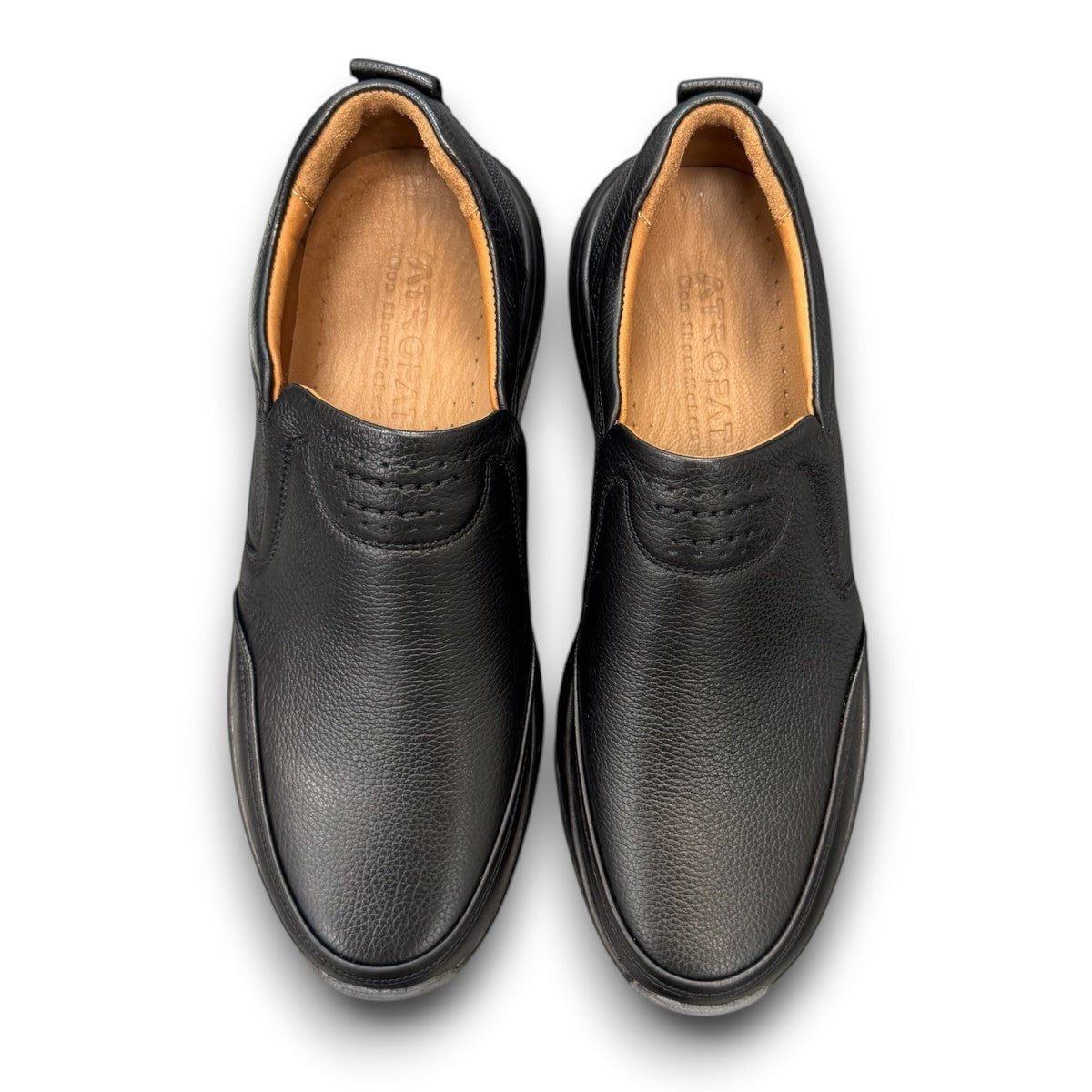 Atropat Kaya black leather slip-on shoes with textured upper and durable rubber sole. Photo of upper view.