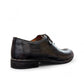 Atropat Kellyi black and navy leather oxford shoe with handmade stitching and rubber outsole. Photo of side view from the back.