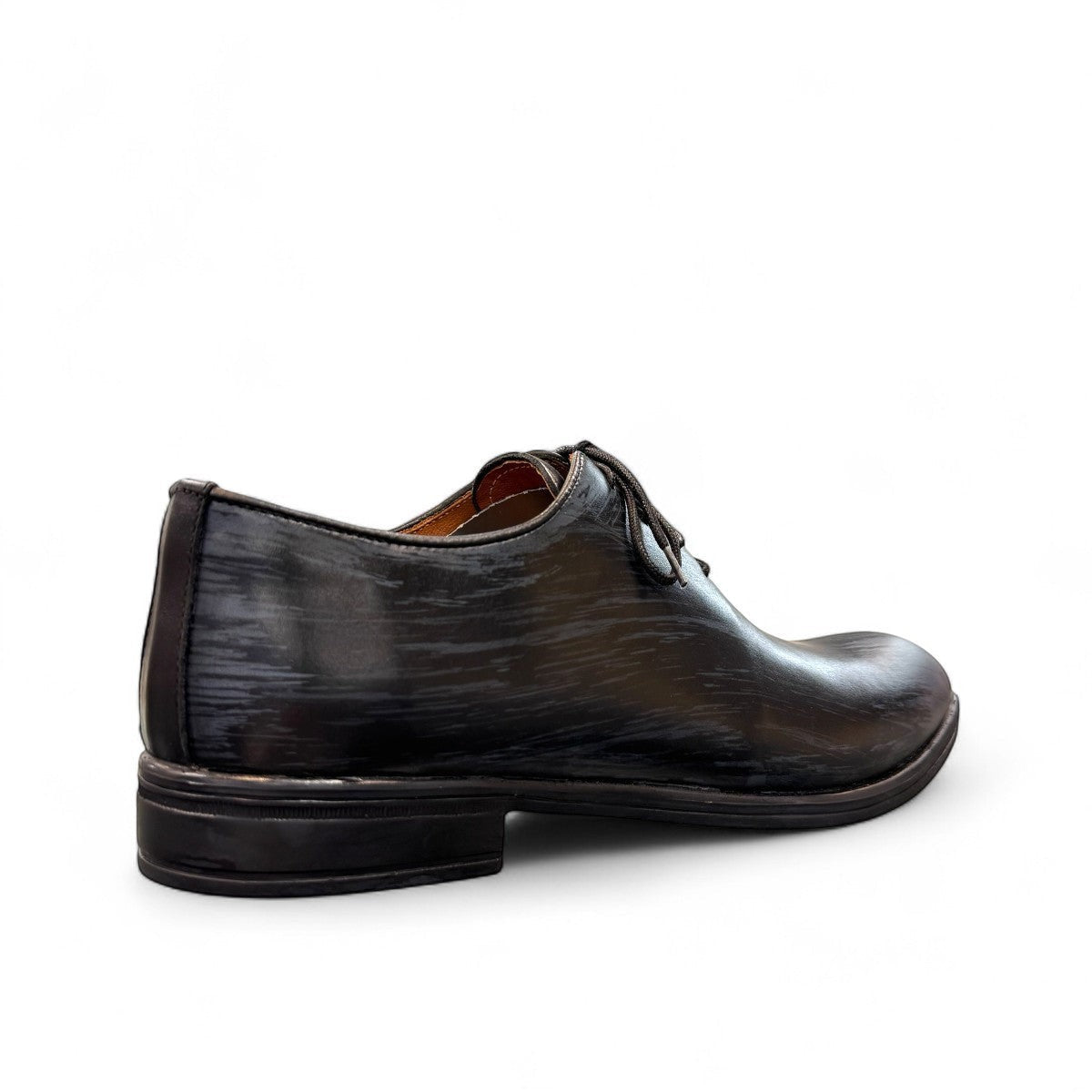 Atropat Kellyi black and navy leather oxford shoe with handmade stitching and rubber outsole. Photo of side view from the back.