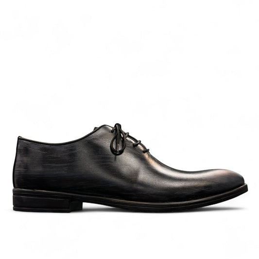 Atropat Kellyi black and navy leather oxford shoe with handmade stitching and rubber outsole. Photo of outside side view.