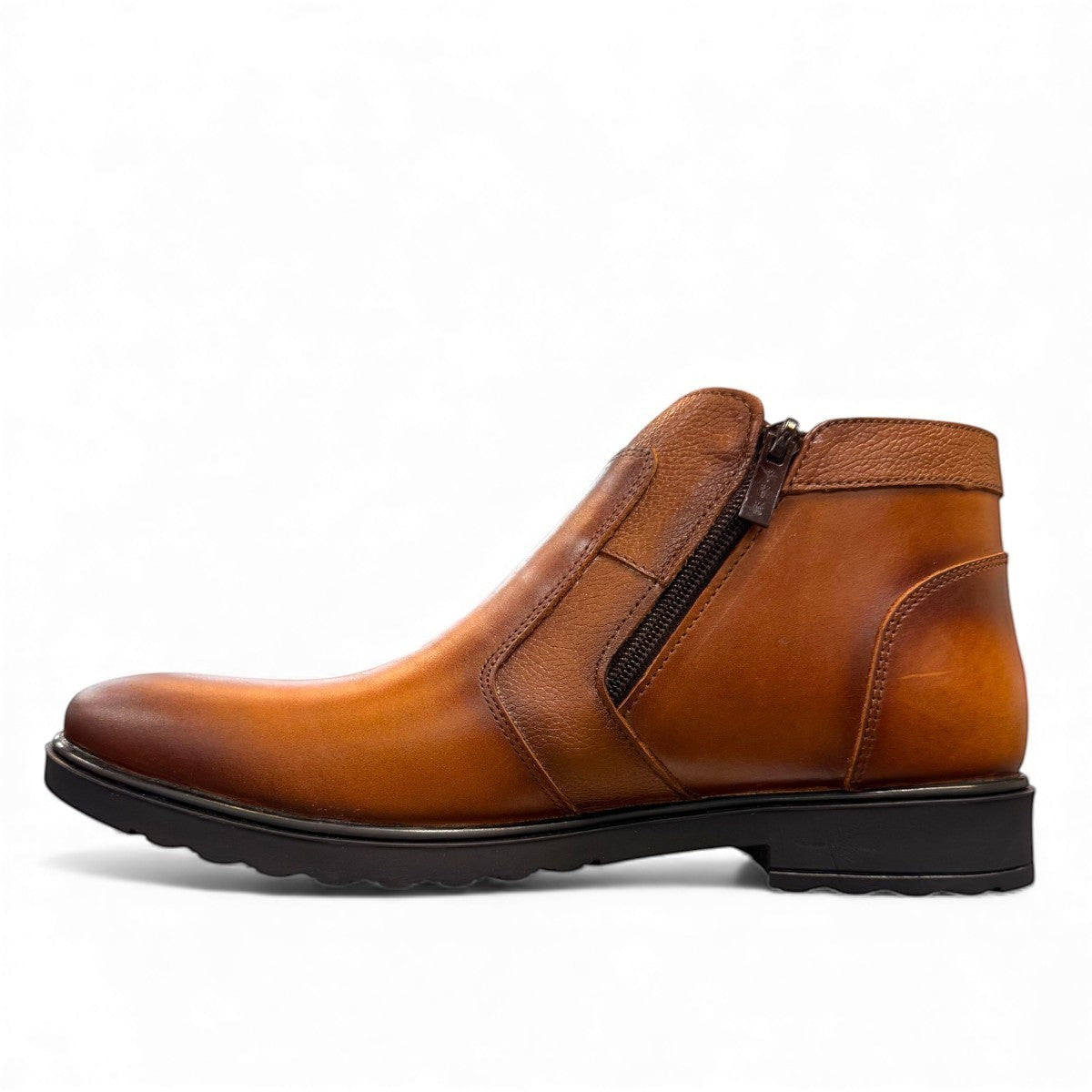 Atropat Nezami light brown leather boots with handmade stitching and a durable rubber outsole. Photo of inside side view.