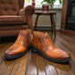 Atropat Nezami light brown leather boots with handmade stitching and a durable rubber outsole. Photo of front view.