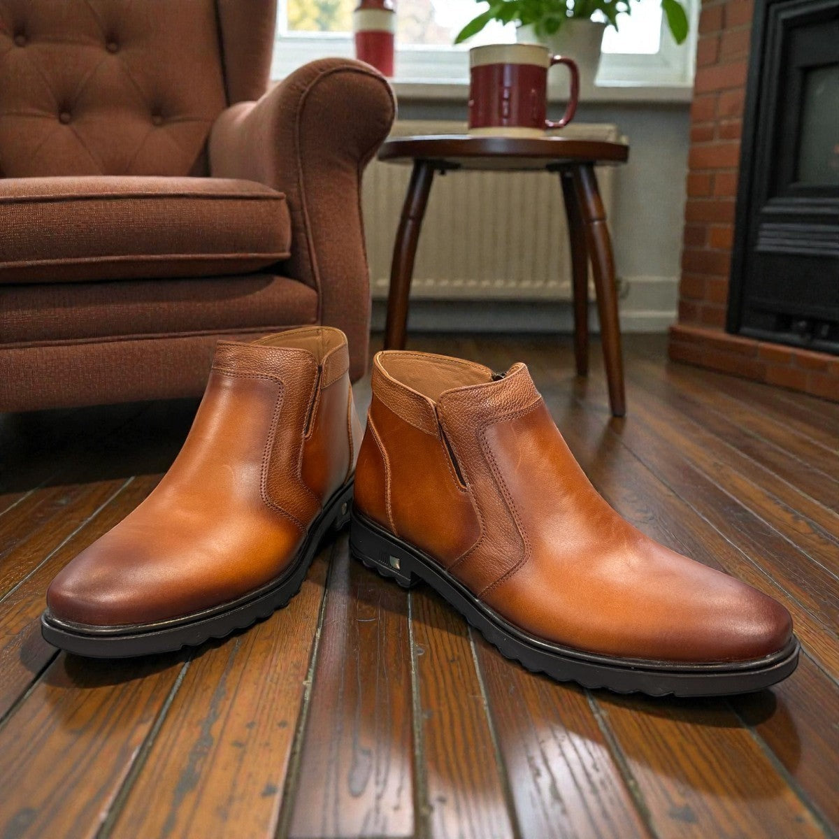 Atropat Nezami light brown leather boots with handmade stitching and a durable rubber outsole. Photo of front view.