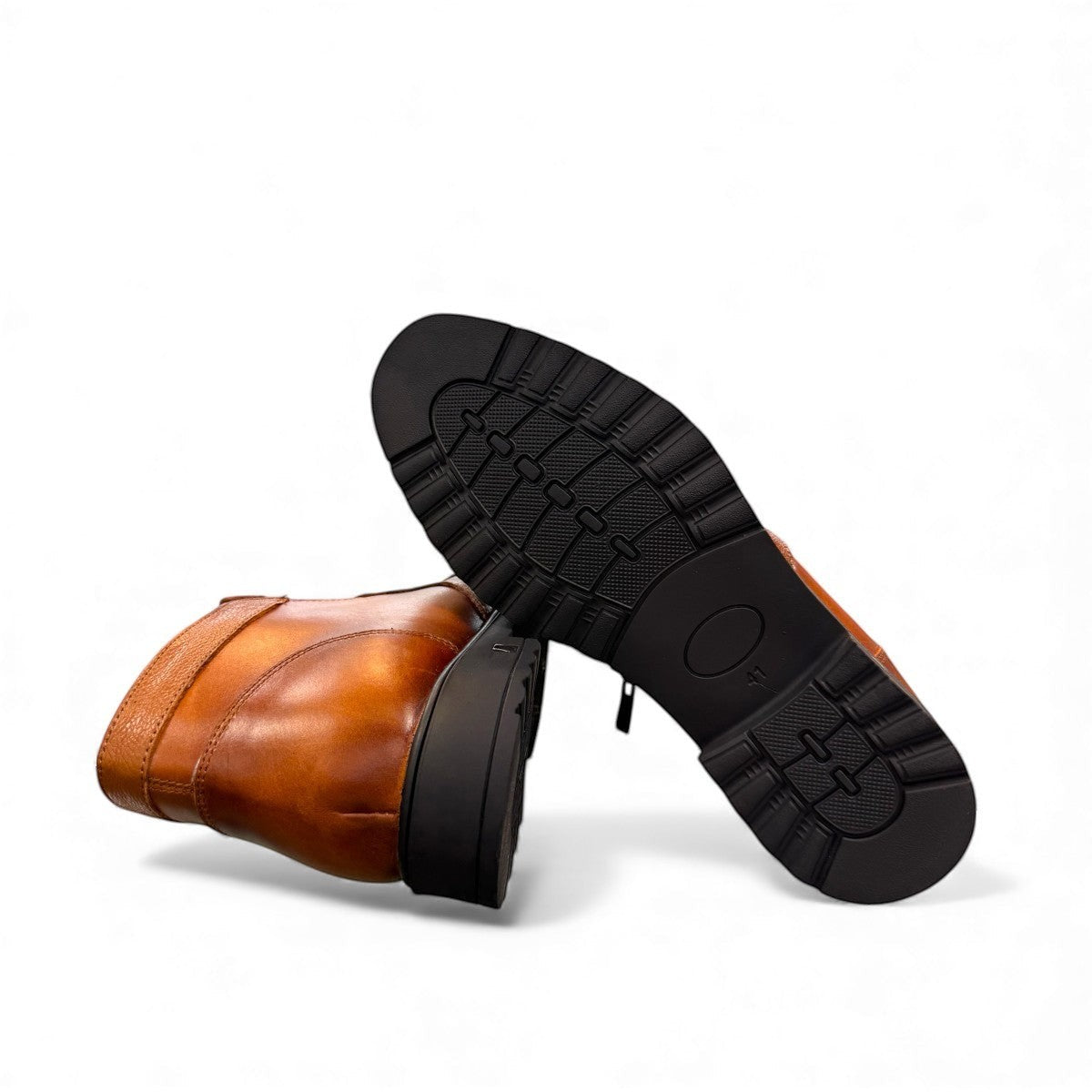 Atropat Nezami light brown leather boots with handmade stitching and a durable rubber outsole. Photo of bottom view.