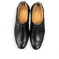 Atropat Parsa black leather slip-on shoe with handmade stitching and durable rubber outsole. Photo of soles.