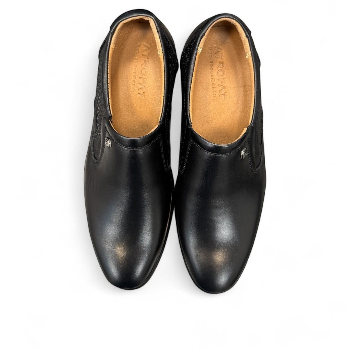 Atropat Parsa black leather slip-on shoe with handmade stitching and durable rubber outsole. Photo of soles.