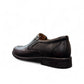 Atropat Parsa black leather slip-on shoe with handmade stitching and durable rubber outsole. Photo of side view from the back.