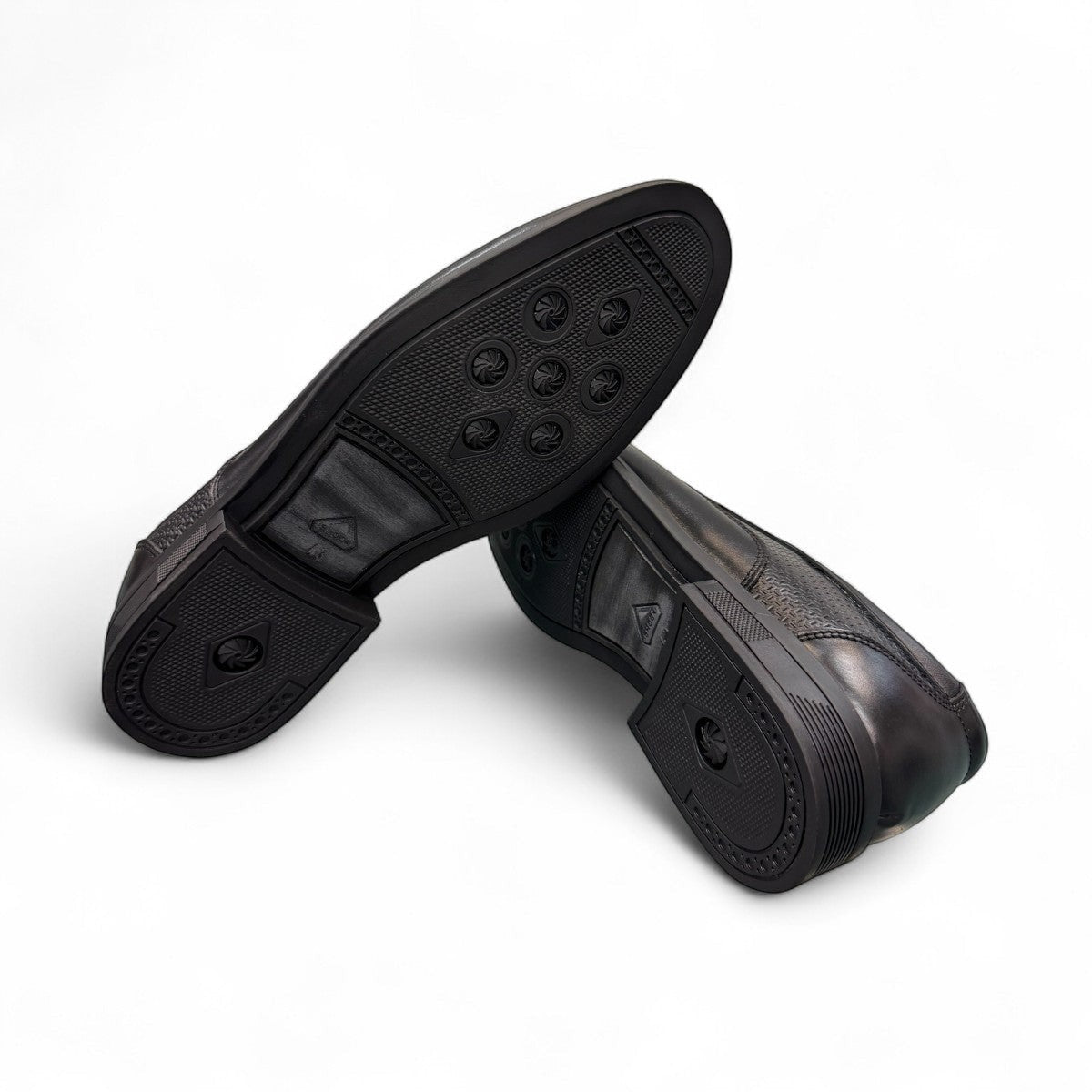 Atropat Parsa black leather slip-on shoe with handmade stitching and durable rubber outsole. Photo of bottom view.