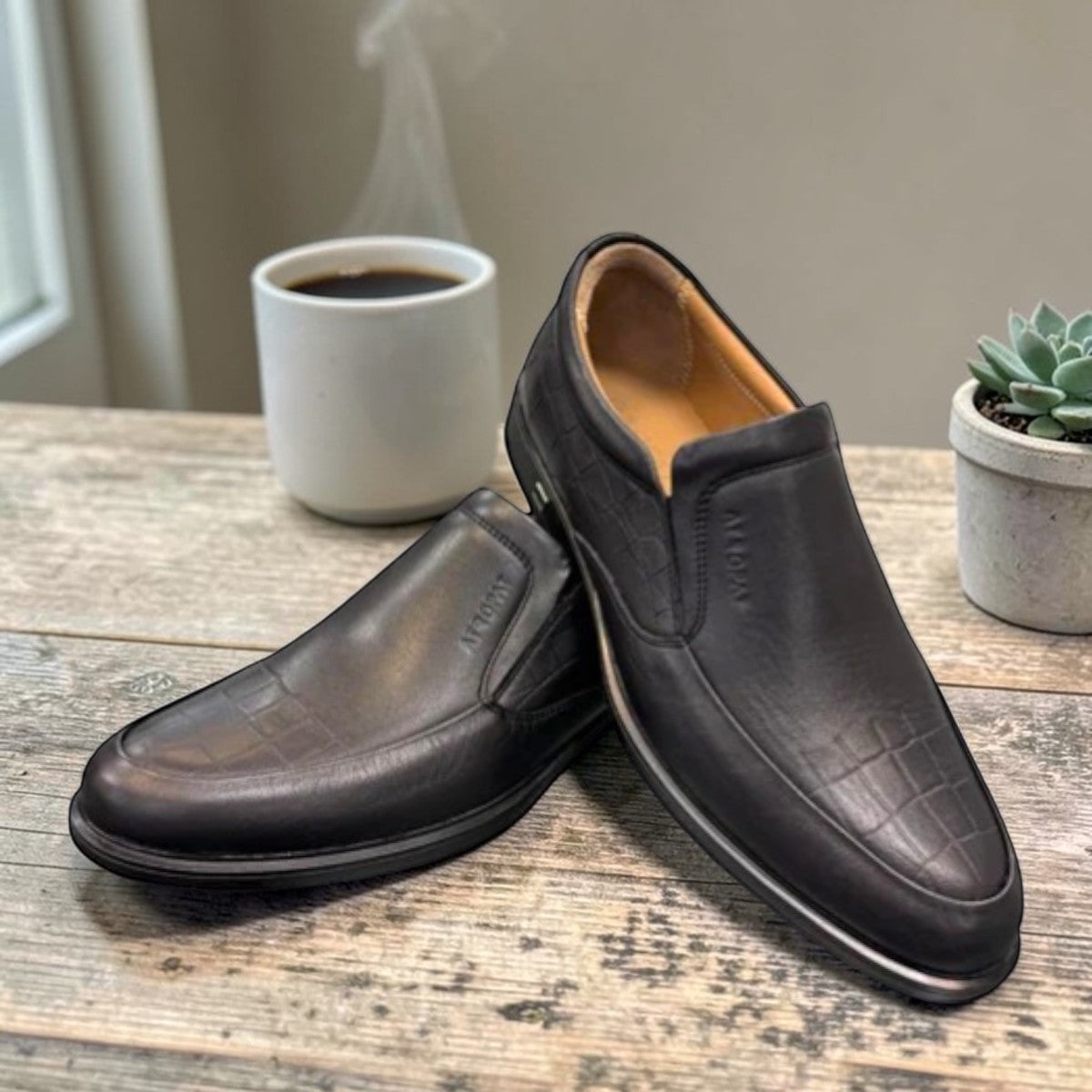 Atropat Ramtin black genuine leather slip-on boots with textured detail and durable rubber outsole. Photo of front view.