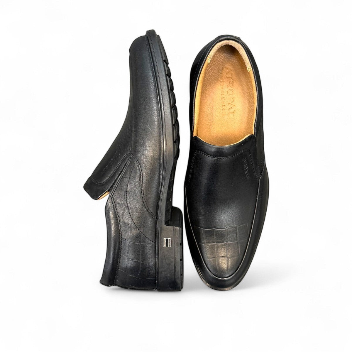 Atropat Ramtin black genuine leather slip-on boots with textured detail and durable rubber outsole. Photo of sole.