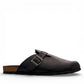 Biotime Burly black leather clogs showing the textured EVA outsole and cork footbed from below.