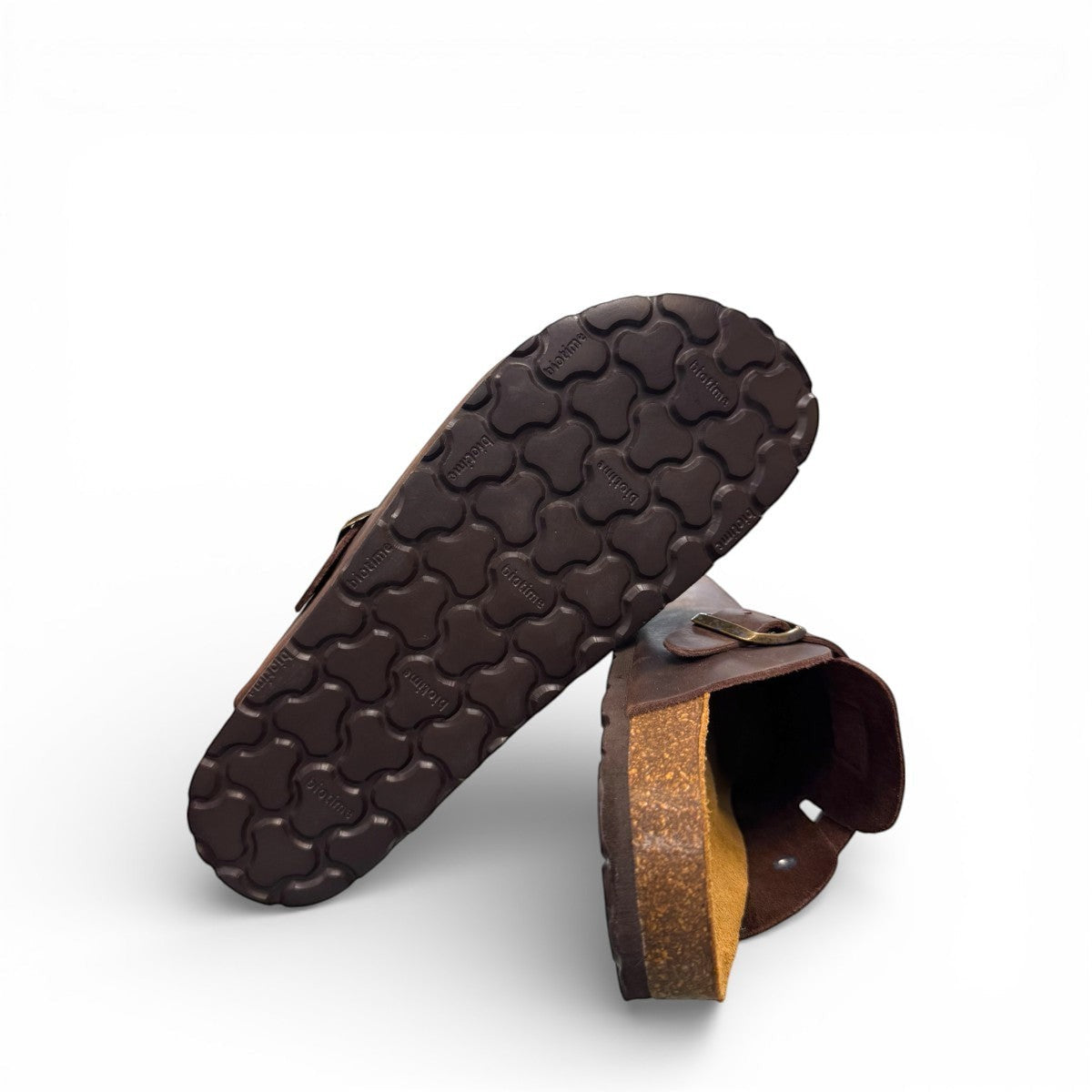 Biotime Burly dark brown oiled leather clogs showing the patterned EVA outsole and cork footbed.
