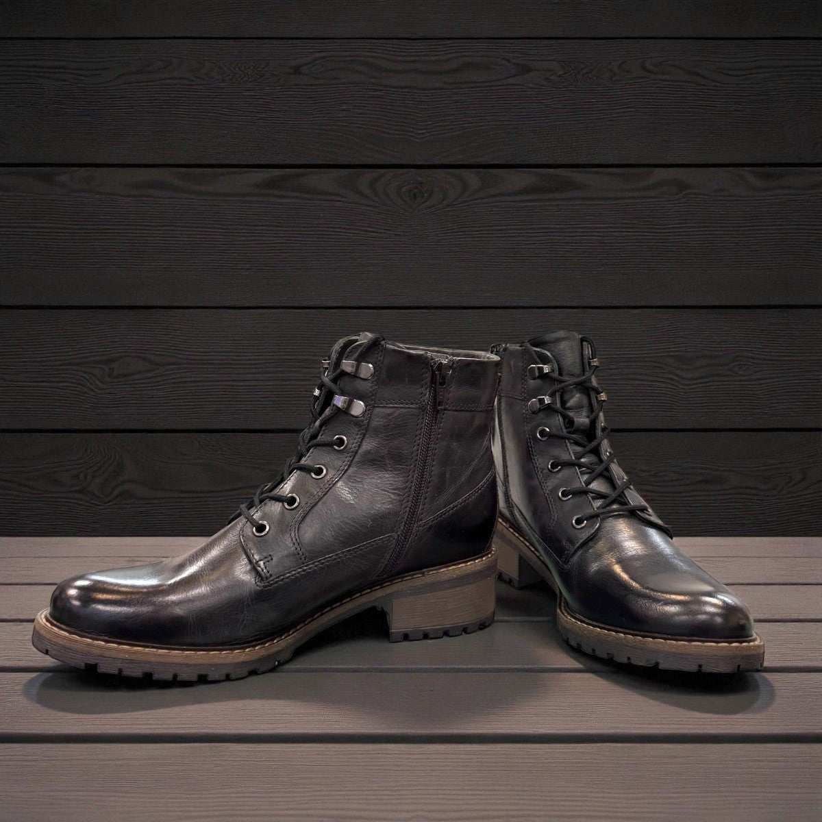 Biotime Lisa black boot showing the durable TPR lugged outsole for traction and stability.