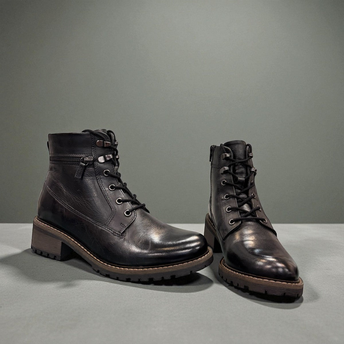 Biotime Lisa black boot showing the durable TPR lugged outsole for traction and stability.
