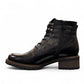 Biotime Lisa black boot showing the durable TPR lugged outsole for traction and stability.