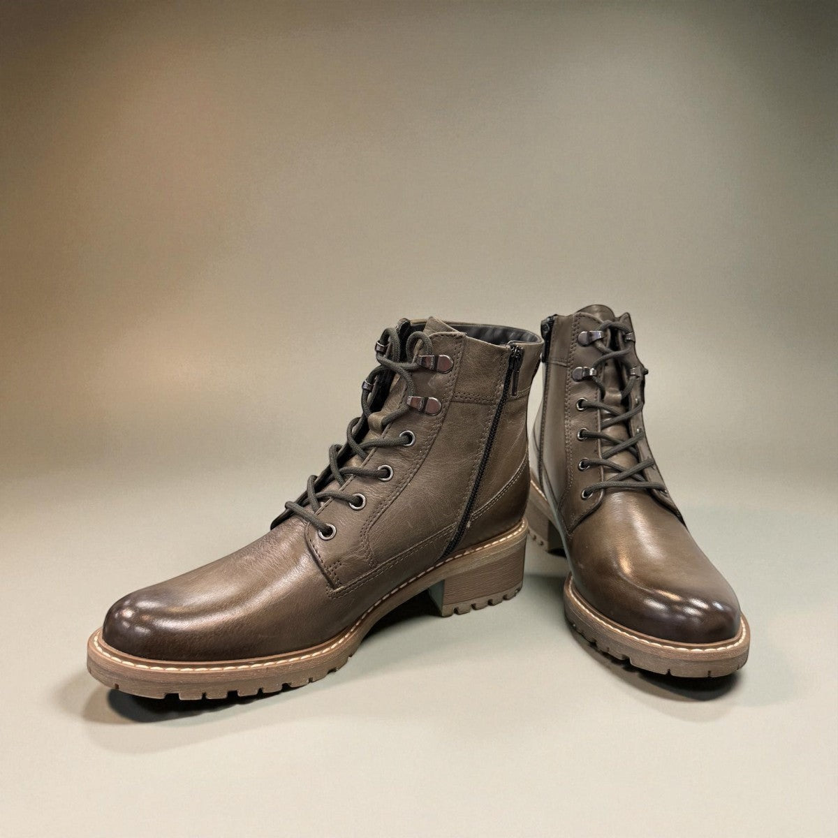 Biotime Lisa green boot showing the durable brown TPR lugged outsole for traction
