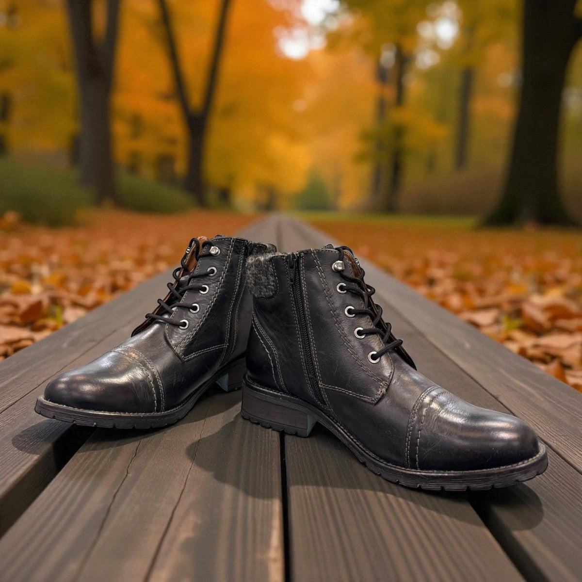 Biotime Stella black leather boots with lace-up front, side zippers, and durable treaded TPR outsoles.