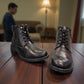 Biotime Stella black leather boots with lace-up front, side zippers, and durable treaded TPR outsoles.