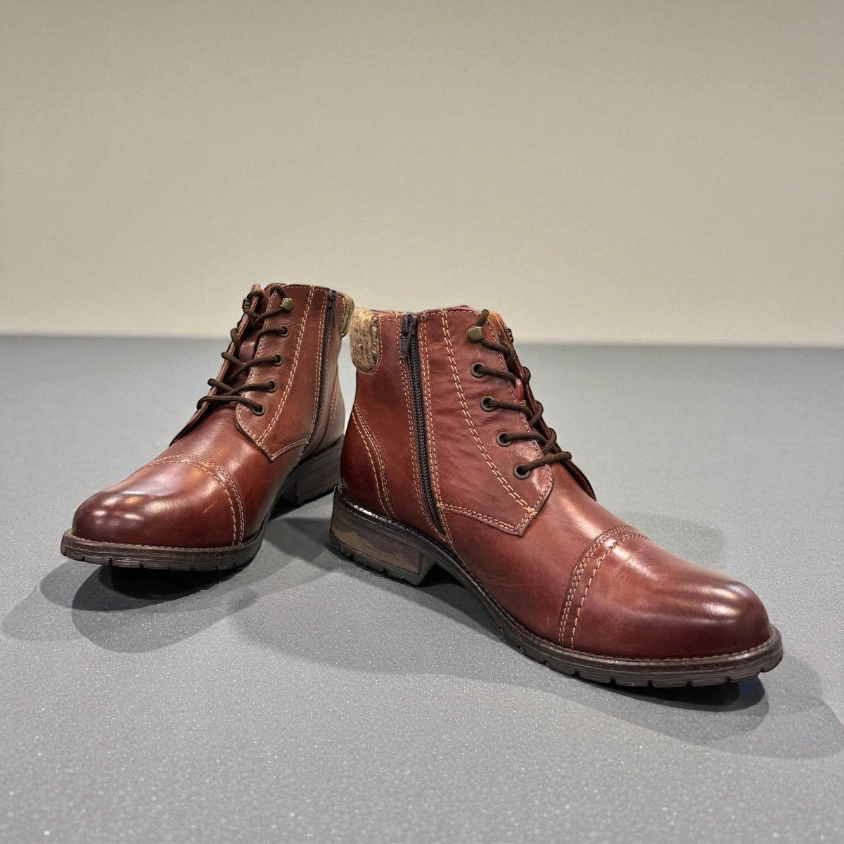 Biotime Stella burgundy leather boots with dual zippers, laces, and durable traction outsoles.
