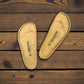 authentic Birkenstock cork footbed replacements for sandal repair on a rustic wooden background