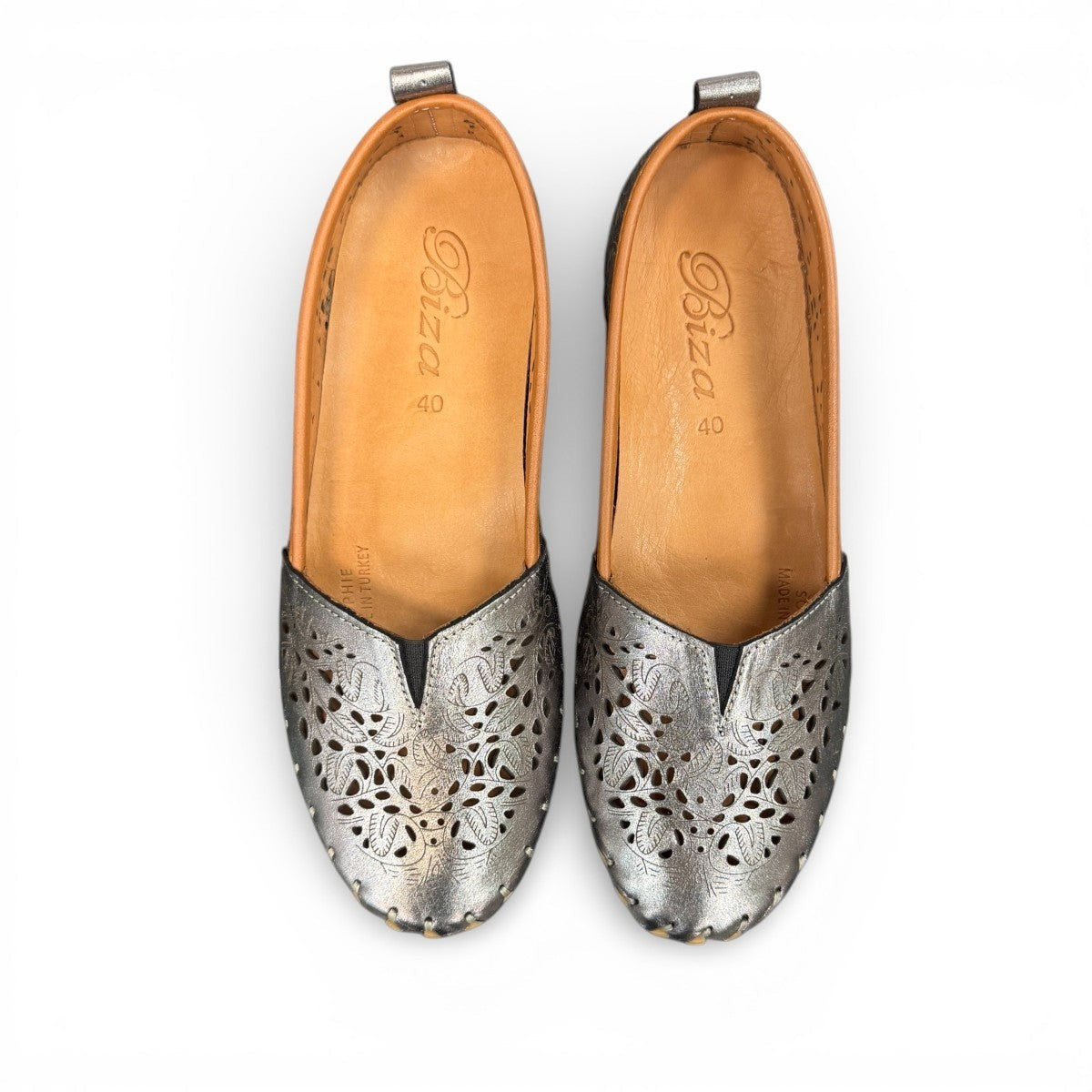 Biza Sophie pewter leather slip-on loafer with laser-cut floral detailing and handstitched construction.