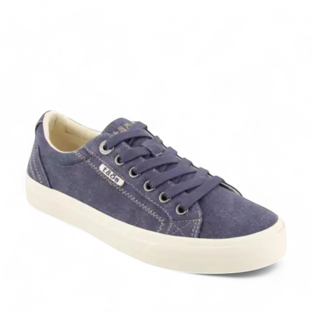 Taos Plim Soul blue wash canvas sneaker with thick rubber platform and decorative zigzag stitching. Photo of front view.